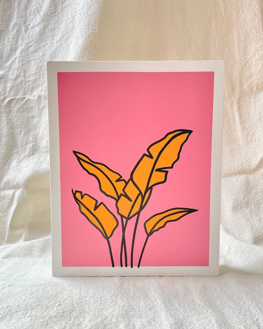 Arte con la técnica de línea clara que ilustra una hoja de plátano naranja sobre color rosado, tamaño 19.5 x 24.5 cm