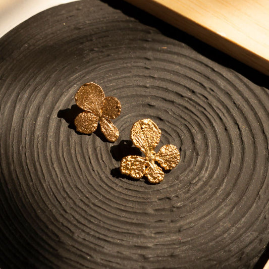 Topitos Besitos, hechos artesanalmente en baño de oro.