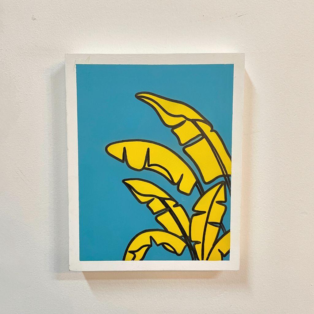 Arte con la técnica de línea clara que ilustra hoja de plátano amarillo sobre color turqueza.